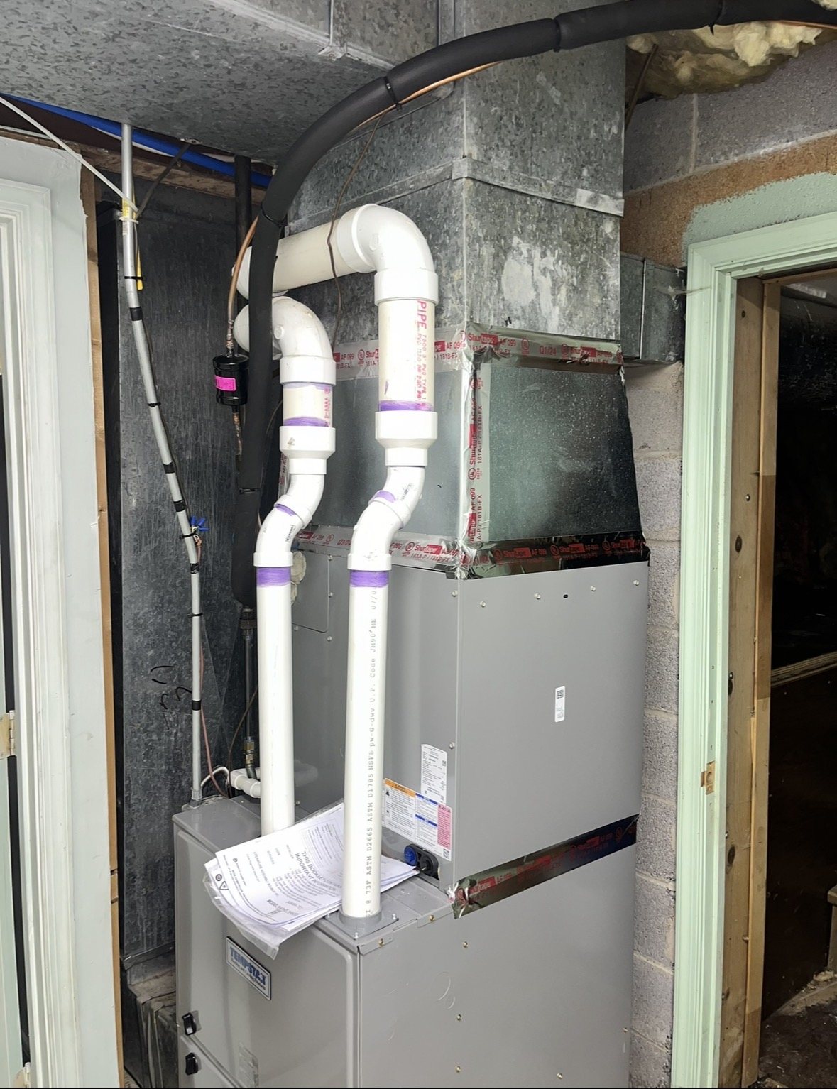 High-efficiency furnace installation with PVC venting